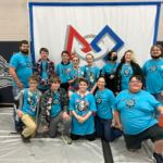 A group of students in a club posing at a convention.