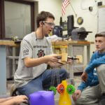 Members of Red Thunder Robotics working on a project.